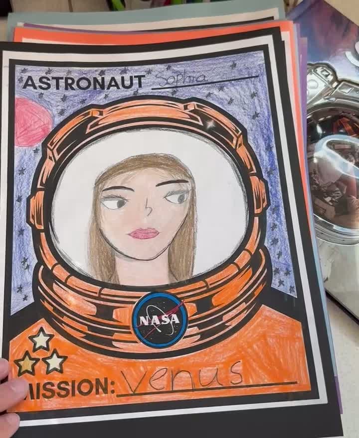 Student-colored astronaut portrait craft with a self-drawn face inside a space helmet
